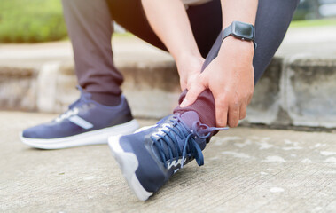  Runner suffering ankle pain during outdoor workout