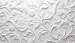 © Vadym - Embossed white floral pattern with swirling vines, delicate flowers. Texture shows intricate curves, scrollwork, suggesting elegant, vintage, modern decorative surfaces for paper, fabric, walls.