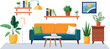 © Rizky - Cozy living room featuring a sofa, bookshelf, lamp, and potted plants, creating a warm and inviting atmosphere.