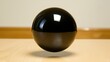 © Дмитрий Петров - A black sphere with a white light reflecting off of it.