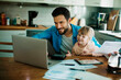 © Geber86 - Father and daughter working together at home