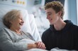 © Prazis Images - Young grandson cheerfully visiting his happy grandmother in the hospital
