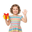 © ning - Smiling Child in Colorful Dress Holding Gift Box and Waving on White Background