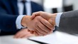 © pkproject - Two businessmen in suits shaking hands to finalize a deal or establish a new professional partnership, symbolizing trust, coope n, and future growth opportunities.