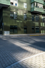 Urban street corner in Stockholm with shadow and minimalist façade, Scandinavian architecture providing copy space and clean background for graphic layouts, posters and visual communication