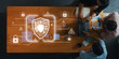 © InfiniteFlow - Professionals collaborate in a modern office, discussing cybersecurity strategies while digital symbols of data protection and safeguard measures surround them. Trope