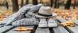 © fitriyah - Cozy fall fashion accessories knit sweater hat sneakers on bench