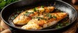 © fitriyah - Pan fried fish fillets golden brown herb seasoning melted butter culinary food image