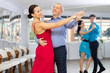 © JackF - Adult woman and old man dancing in dance class