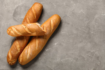 Wall Mural - Fresh baguettes on grey background