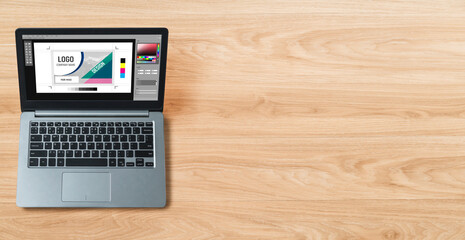 Graphic designer software for modern design of web page and commercial ads showing on the computer screen