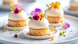 Delicate miniature desserts with floral garnish