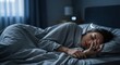 © Mila Shnobel - Futuristic smart ring displays health data while user sleeps peacefully in a modern bedroom
