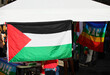 gazebo during a demonstration with a Palestine flag and a colorful PACE flag meaning PEACE