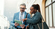 © peopleimages.com - Lawyers, people and tablet in city with discussion for court prep, litigation or judicial policy online. Review case notes, team or mature man and woman outdoor, tech and ready for legal hearing
