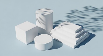 A collection of white geometric shapes including a cube, cylinder, and stepped pyramid on a light blue surface with shadow patterns