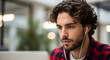 © Sulfabndi - Focused young man listening to music while working on laptop modern office workspace technology headphones concentration productivity employee