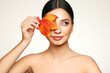 © Oleg Gekman - Portrait of beautiful young woman with autumn leafs. Healthy clean fresh skin natural make up beauty eyes and red nails