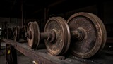 Rusty industrial wheels on wooden platform