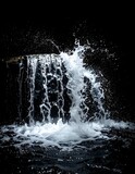 Waterfall splash in dark cave