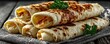 © Georgii - Stack of freshly cooked flour tortillas garnished with parsley on a rustic table