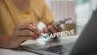 © FAMILY STOCK - Digital document approval process with person confirming files on laptop. Concept of e-approval, online verification, business workflow, and paperless office solutions for modern organizations.