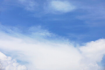 Wall Mural - fantastic soft white clouds against blue sky and copy space horizontal shape.