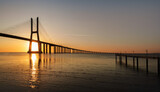 Sunrise Over Vasco da Gama Bridge Spanning the Tagus River in Lisbon, Portugal