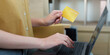 © Natee Meepian - Online shopping. Making a purchase with credit card and laptop.