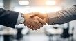 © andrehsnl - Close up showing two people shaking hands, symbolizing agreement or partnership.