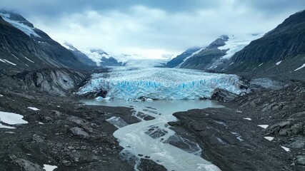 Wall Mural - Ancient glacier ice slowly melts and retreats, revealing the raw power of nature's transformation in a dramatic environmental timelapse dramatic, frozen, climate change