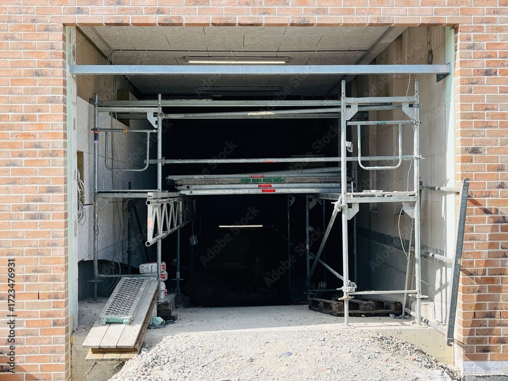 Entrance to an underground parking garage under construction in a new