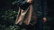 © JGenerative - Casual Fashionable Person Holding Sustainable Fabric Tote Bag