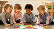 © Nur - Adorable toddlers playing together learning alphabet colorful letters early childhood education daycare preschool development child care kids toddlers group learning