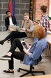 © TrueFrame Collective - Collective thinking. Group of young creative startuppers putting their heads together and developing new business strategies while having meeting in office