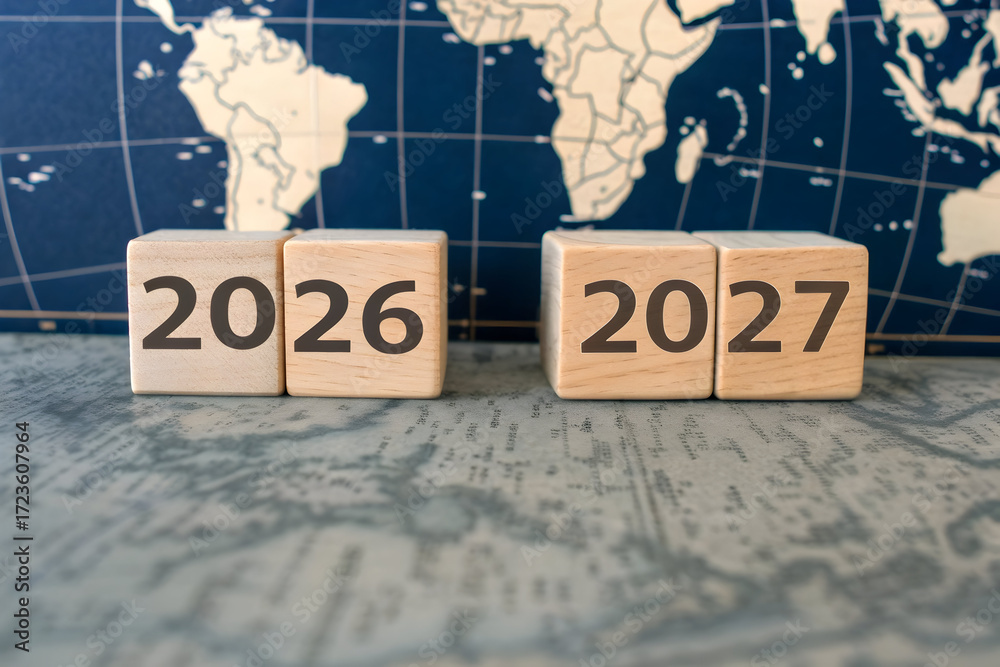 Wooden Blocks Transitioning from 2026 to 2027 with Blue World Map Stock ...
