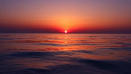Wall Mural - stunning ocean horizon sunset timelapse with beautiful colors reflecting on calm water climate, peac