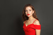 © artmim - Perfect brunette woman with trendy make-up and brown curly hair wavy hairstyle and red lips makeup on black background