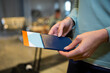 © Wavebreak Media - Woman holding passport boarding pass by suitcase handle at airport lounge, copy space
