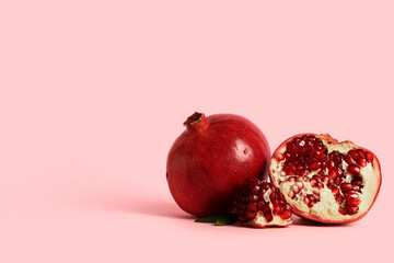 Wall Mural - Fresh ripe pomegranates on pink background