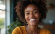 © feng - Smiling african american woman looking at camera. High quality