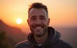 © li - Portrait of happy mid adult man smiling at sunset. High quality