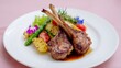 © fotogurme - Sumptuous lamb chops crown a vibrant bouquet of rosemary-infused vegetables, evoking symphony celebratory feasts and Spring Equinox banquets