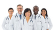 © Hanan - Diverse group of doctors isolated on white background standing together, smiling and wearing white coats and stethoscopes around their necks