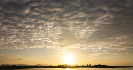 Wall Mural - Timelapse sunset over the river and horizon sky