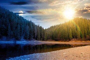 Wall Mural - scenic landscape by the lake on autumn equinox among forest. day and night time change. beautiful scenery of national park in fall season with sun and moon. colorful environment reflection in the pond
