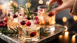 © Milos - A beautiful arrangement of holiday drinks adorned with cranberries and rosemary, set in a cozy environment to celebrate the joy and spirit of the season.