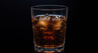 © Pixel - Refreshing cola drink with ice cubes in a glass on a black background