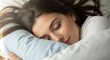 © Tita - relaxed woman peacefully sleeping indoors