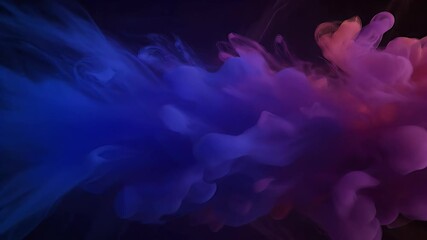 Vibrant blue, purple, and pink smoke cloud in dark water. Abstract fluid background with dynamic color explosion.